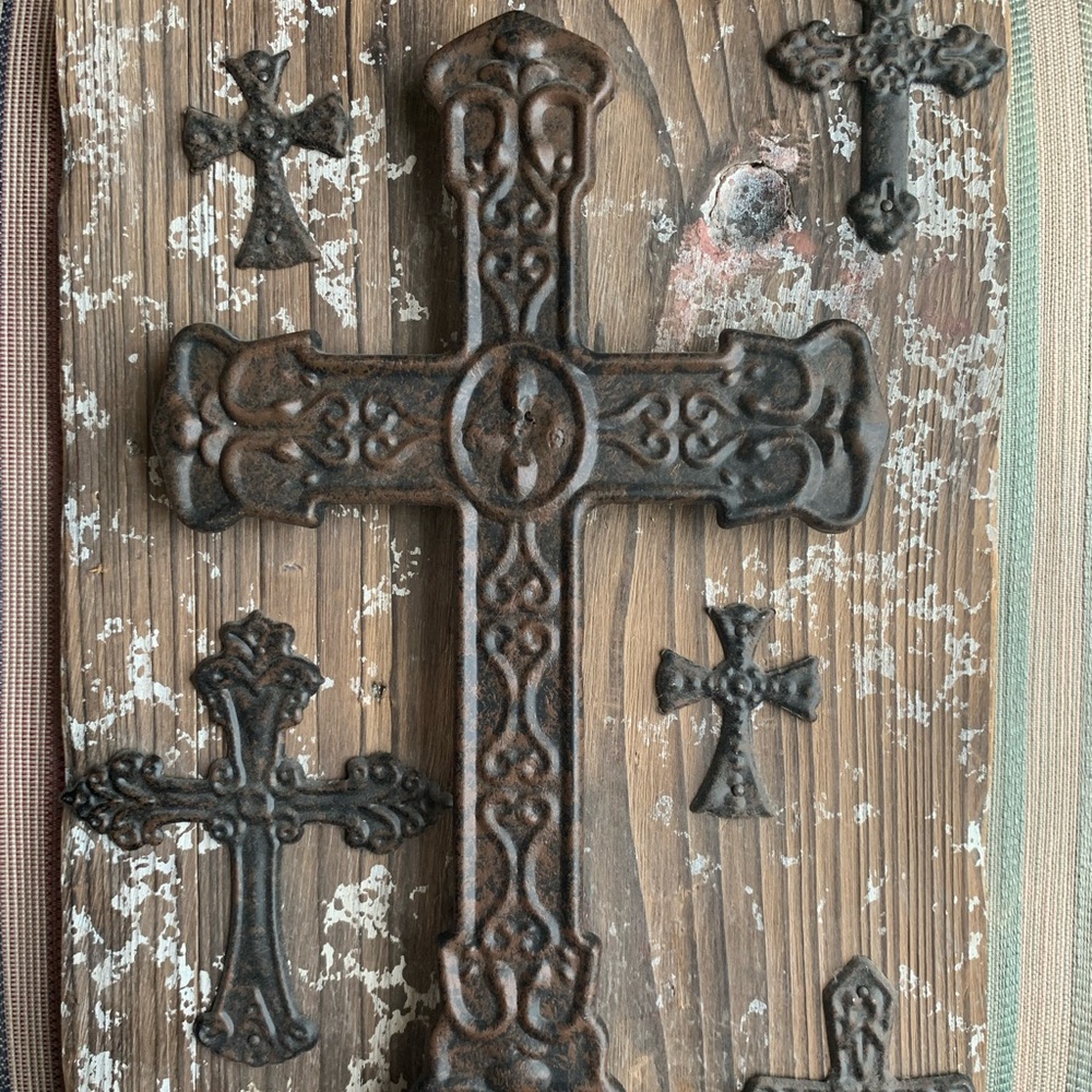 Wooden plaque with metal crosses
